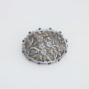 Silver brooch with floral decoration